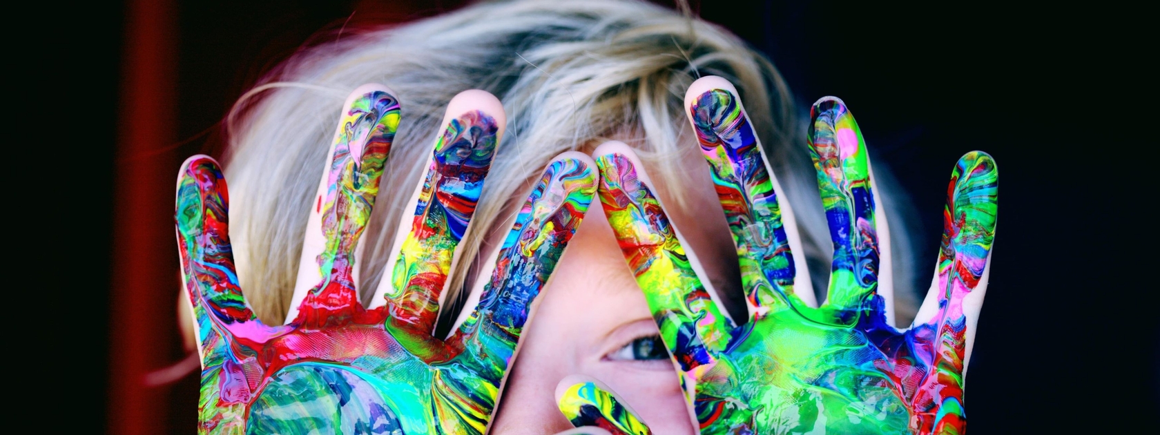 Child showing painted hands